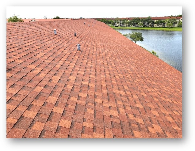 Completed red shingle condo roof with waterfront lake view – Job 22-071-F