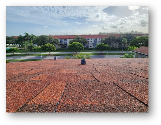Completed red shingle condo roof with ridge and pipe boots – Job 22-072-G