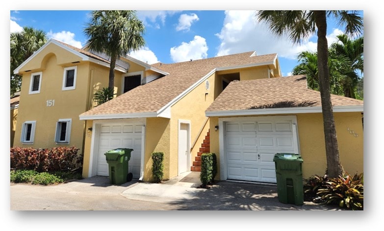 Completed shingle roof on yellow condo townhome – Job 23-010
