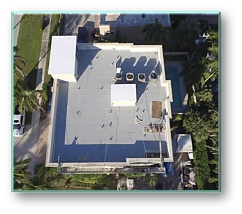 Aerial view of completed commercial flat roof with pool and palm trees – Job 25-019 Deerfield