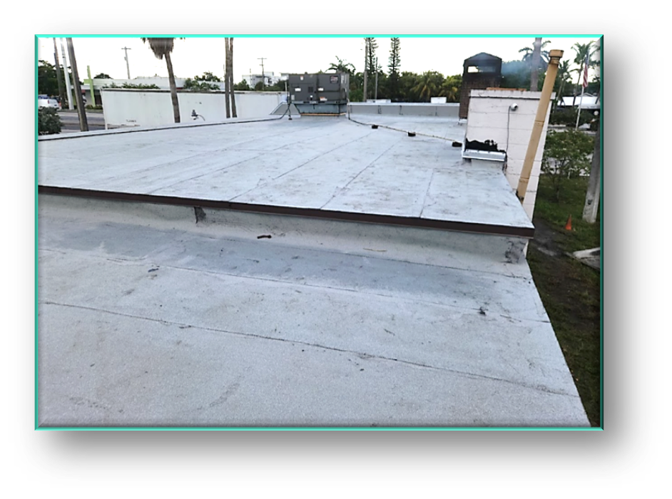 Completed commercial flat roof membrane with parapet wall detail – Job 26-016
