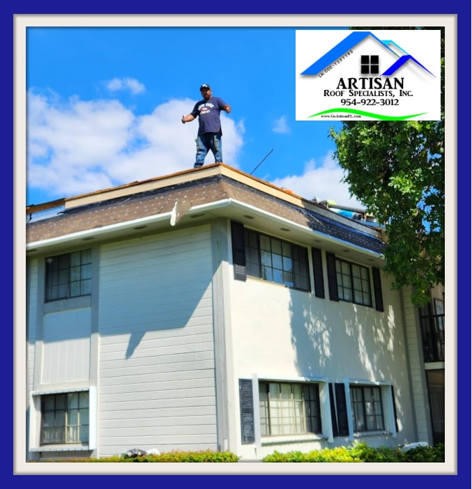 Artisan roofer standing on top of condo building during shingle roof replacement – 2022 Carmel Project