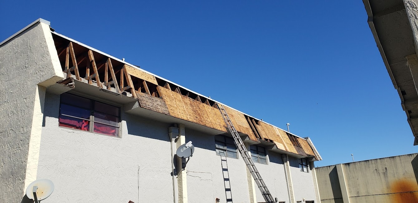 Century Gardens condo building with new underlayment installed and ladder staged – Lauderhill, FL