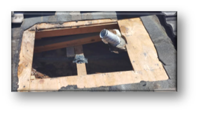Open roof deck hole with new plywood framing and pipe stub installed – Job 26-098
