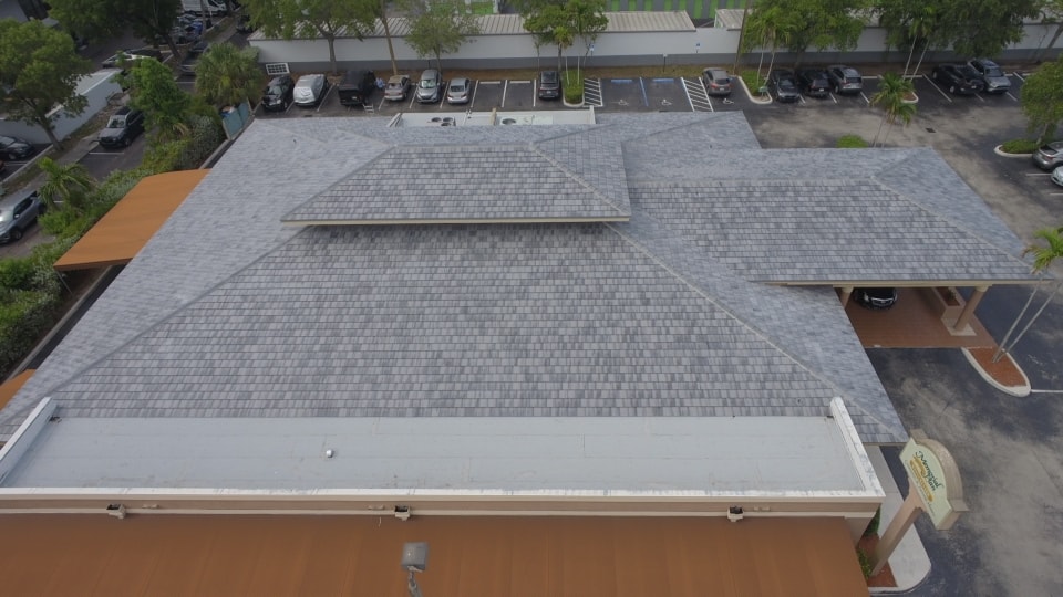 Aerial view of completed tile roof with parking lot – Job 25-127