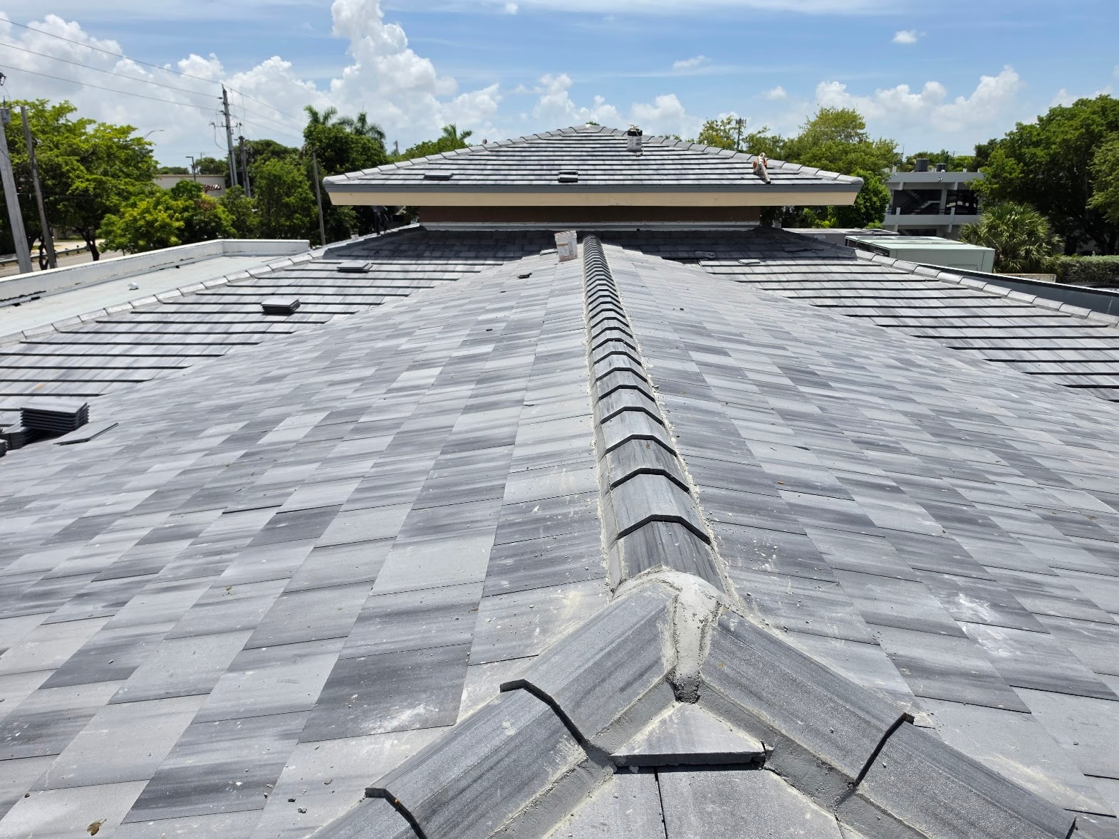 Ridge cap detail on completed concrete tile roof – Job 25-127