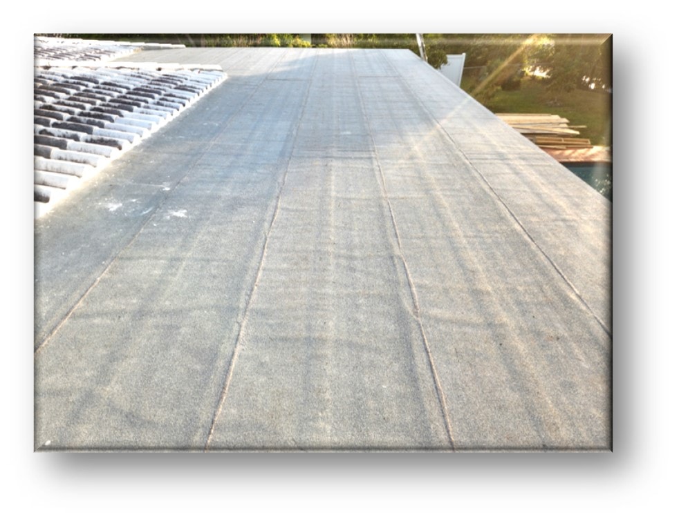 Completed flat roof surface with tile roof adjacent – Job 25-014