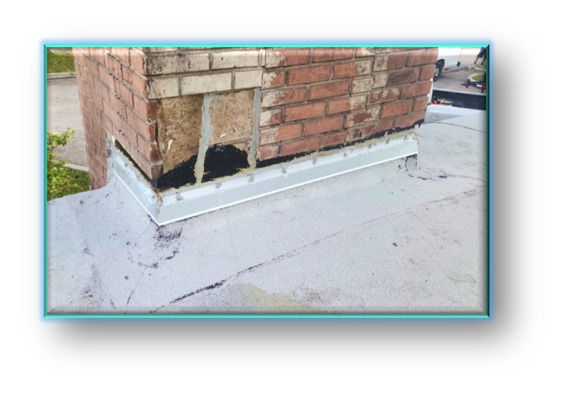 Flat roof flashing detail at brick chimney – Job 26-016